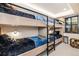 Stylish bunk room with sleeping for four, featuring modern fixtures and plush bedding at 224 S Ridge St, Breckenridge, CO 80424
