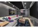Comfortable home theater room with a large screen, plush seating, and modern lighting at 224 S Ridge St, Breckenridge, CO 80424
