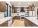 Modern kitchen with stainless steel appliances, a white countertop island, and wood finish cabinets at 224 S Ridge St, Breckenridge, CO 80424