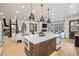 Spacious kitchen with a large island, modern appliances, recessed lighting and hardwood floors at 224 S Ridge St, Breckenridge, CO 80424