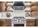 Close up of a kitchen featuring a modern oven with a white countertop, stainless steel appliances, and wood cabinets at 224 S Ridge St, Breckenridge, CO 80424