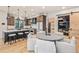 Open concept home featuring a kitchen, dining table and chairs, and living room with a sliding barn door at 224 S Ridge St, Breckenridge, CO 80424