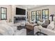 Stylish living room showcasing a modern fireplace, plush seating, and views of the outdoors at 224 S Ridge St, Breckenridge, CO 80424