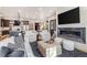 Open-concept living room and kitchen with modern finishes, a cozy fireplace, and ample seating at 224 S Ridge St, Breckenridge, CO 80424