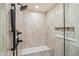 Walk-in shower with sleek tile, bench, niche, and modern fixtures at 224 S Ridge St, Breckenridge, CO 80424