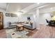 Inviting basement featuring neutral couches, a rug, and a workspace in the corner at 7641 Lebrun Ct, Lone Tree, CO 80124