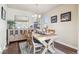 Cozy dining area with stylish decor, including a wooden table and accent mirror at 7641 Lebrun Ct, Lone Tree, CO 80124