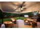 Relaxing outdoor patio with ceiling fan, lounge chairs and dining area, perfect for entertaining at 6512 Upham St, Arvada, CO 80003