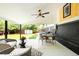 Relaxing outdoor patio with ceiling fan, lounge chairs and dining area, perfect for entertaining at 6512 Upham St, Arvada, CO 80003