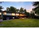 Backyard featuring lush lawn and covered patio for outdoor living and entertaining at 6512 Upham St, Arvada, CO 80003