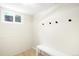 Basement area with a bench and hooks near the window at 6512 Upham St, Arvada, CO 80003
