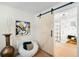 Tastefully styled bathroom featuring a barn door and modern finishes at 6512 Upham St, Arvada, CO 80003