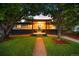 Charming single-story home with welcoming front porch, attractive landscaping, and mature trees at 6512 Upham St, Arvada, CO 80003