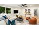 Open living room featuring large windows, comfortable seating, and stylish decor at 6512 Upham St, Arvada, CO 80003
