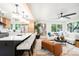 Bright, open-concept living room with modern finishes, a spacious island, and stainless-steel appliances at 6512 Upham St, Arvada, CO 80003
