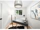Bright home office featuring natural light, hardwood floors, and stylish decorative accents at 6512 Upham St, Arvada, CO 80003