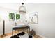Bright office space with large window, hardwood floors, and stylish decor at 6512 Upham St, Arvada, CO 80003