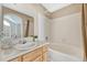 Bathroom with a single sink vanity and tiled shower and tub combo at 1354 Carlyle Park Cir, Highlands Ranch, CO 80129