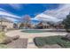 Community pool area with covered pavilion, landscaping, and seating for residents to enjoy at 1354 Carlyle Park Cir, Highlands Ranch, CO 80129