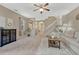 Spacious living room with neutral tones, a ceiling fan, and stairway at 1354 Carlyle Park Cir, Highlands Ranch, CO 80129