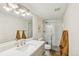 Basement bathroom boasts modern vanity and shower at 3267 Stuart St, Denver, CO 80212