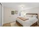 Bright and airy basement bedroom with wood floors at 3267 Stuart St, Denver, CO 80212