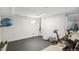 Home gym in basement, featuring Peloton bike and weights at 3267 Stuart St, Denver, CO 80212