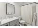 Clean bathroom with a tub, shower, and modern vanity at 3267 Stuart St, Denver, CO 80212