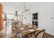 Open concept dining room with exposed brick and modern lighting at 3267 Stuart St, Denver, CO 80212