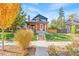 Brick home with landscaping and walkway leading to front entrance at 3267 Stuart St, Denver, CO 80212