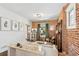 Living room with exposed brick wall and modern decor at 3267 Stuart St, Denver, CO 80212