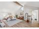 Bright and airy main bedroom with a king-size bed and sitting area at 3267 Stuart St, Denver, CO 80212