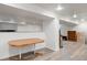 Open unfinished basement area featuring wood laminate flooring and neutral walls at 4650 S Laredo St, Aurora, CO 80015