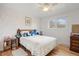 Cozy bedroom with hardwood floors, comfortable bed, and ample natural light at 4650 S Laredo St, Aurora, CO 80015