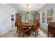 Charming dining room with a round table and tile flooring next to the kitchen area at 4650 S Laredo St, Aurora, CO 80015
