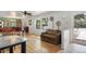 Inviting living room with hardwood floors, bright windows and an open floorplan create a spacious feel at 4650 S Laredo St, Aurora, CO 80015