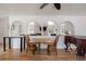 Open-concept living space featuring hardwood floors, arched features and an open floorplan at 4650 S Laredo St, Aurora, CO 80015