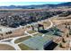 Aerial view of neighborhood with park, playground, and basketball court at 19011 W 84Th Ave, Arvada, CO 80007