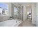 Luxurious bathroom featuring a soaking tub and walk-in shower at 19011 W 84Th Ave, Arvada, CO 80007