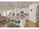 Island kitchen with granite countertops and white cabinets at 19011 W 84Th Ave, Arvada, CO 80007