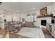 Spacious living room with corner fireplace and large windows at 19011 W 84Th Ave, Arvada, CO 80007