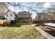 Exterior view of backyard features mature trees, pergola, green grass and hammock at 2823 N Lafayette St, Denver, CO 80205