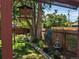 Serene backyard view featuring a well-maintained garden, wooden fence, and decorative fountain at 2823 N Lafayette St, Denver, CO 80205