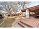 Backyard features pergola-covered deck and dining area, hammock, and mature trees at 2823 N Lafayette St, Denver, CO 80205