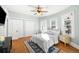 This bedroom features hardwood floors, two closets, and natural light from the large windows at 2823 N Lafayette St, Denver, CO 80205