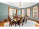 Sun-filled dining room with hardwood floors, ample seating, and natural light at 2823 N Lafayette St, Denver, CO 80205