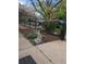 Charming front yard landscaping with black wrought iron fence, bird bath, and decorative gnome at 2823 N Lafayette St, Denver, CO 80205