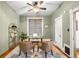 Cozy home office space featuring hardwood floors, neutral paint, and a vintage ceiling fan at 2823 N Lafayette St, Denver, CO 80205