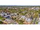 Aerial view featuring a mix of modern townhomes and single-Gathering homes, surrounded by trees at 1287 Quitman St, Denver, CO 80204