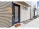 Contemporary front entrance featuring a glass door, modern lighting, and clean architectural lines for a welcoming feel at 1287 Quitman St, Denver, CO 80204
